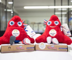 epa10402600 Two different examples, paralympic and not, of the Phrygian, the mascot of the Olympic Games Paris 2024, sit on a table in the factory of the group Doudou et Compagnie in La Guerche de Bretagne, France, 11 January 2023 (issued 13 January 2023). The Doudou et Companie group, specializing in the manufacture of plush toys since 1999, has begun producing the phrygians, the mascots of the Paris 2024 Olympic Games in January 2023. The design of the mascot is inspired by the Phrygian, a cap used during the French revolution. The group is looking to increase the number of seamstresses, from 23 to 50, in order to face the challenges of craft manufacturing, which aims to make more than 500 plush toys per day in full production. The group is responsible for the production of 60 percent of the mascot collections, of which 20 percent will be produced in France, representing 400,000 mascots.  EPA/TERESA SUAREZ