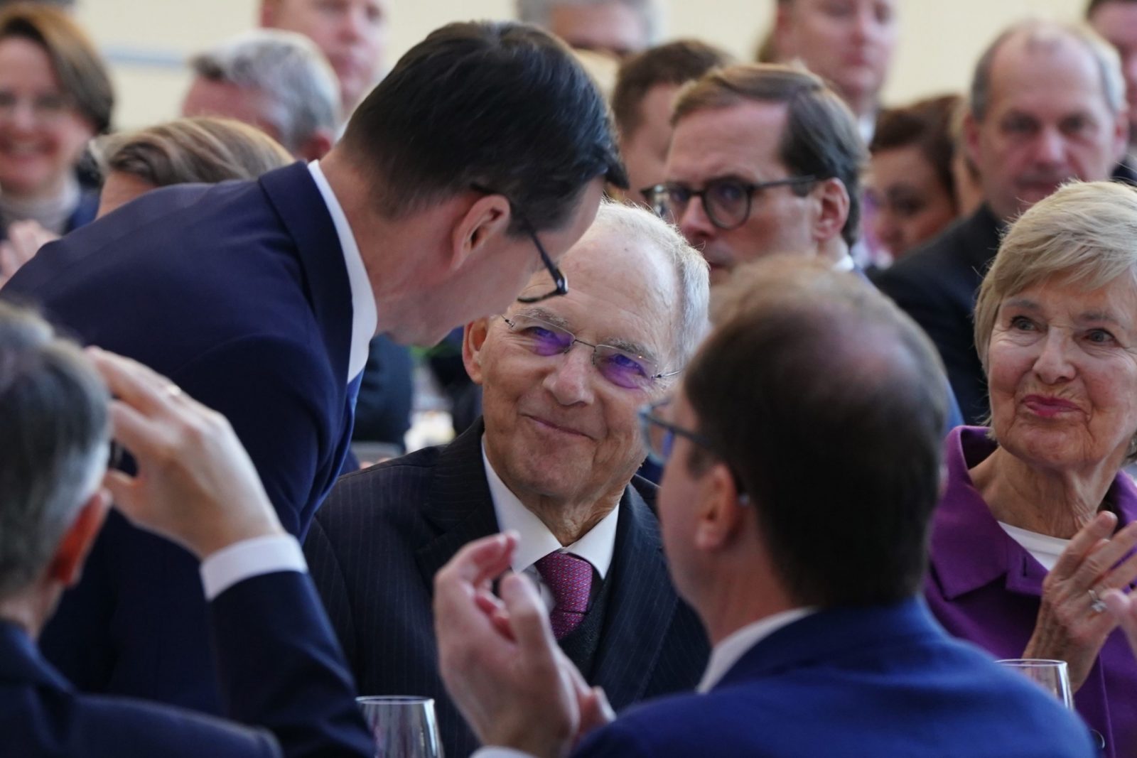 epa10408870 Polish Prime Minister Mateusz Morawiecki (L) talks after his speech to former German Parliament ‘Bundestag’ president Wolfgang Schaeuble (C) during a festive event on the occasion of Wolfgang Schauble's 50th anniversary in parliament, in Berlin, Germany, 16 January 2023. Former German Parliament 'Bundestag' president Wolfgang Schaeuble has served for more than half a century as a member of the German parliament ‘Bundestag. He is the first deputy having participated in parliament for such a long time.  EPA/CLEMENS BILAN / POOL