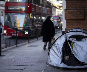 epa10409312 A person walks past a homeless person's tent in Belgravia, an area mostly accommodated by wealthy international residents in London, Britain, 16 January 2023. According to OXFAM charity's 'Survival of the Richest' report, the richest one per cent in the UK are now wealthier than 70 per cent of the population and the world's super-rich one per cent own nearly two-thirds of all new wealth created since the pandemic started.  EPA/TOLGA AKMEN