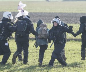 epa10410924 Policemen clash with protesters during a rally of climate protection activists near the village of Luetzerath, Germany, 17 January 2023. The village of Luetzerath in North Rhine-Westphalia state is to make way for lignite mining despite the decision to phase out coal. The Garzweiler open pit mine, operated by German energy supplier RWE, is at the focus of protests by people who want Germany to stop mining and burning coal as soon as possible in the fight against climate change.  EPA/RONALD WITTEK