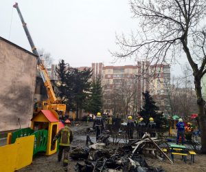 epa10412803 Rescue services work at the scene of a helicopter crash in Brovary, near Kyiv, Ukraine, 18 January 2023. At least 18 people died, including three children, after a helicopter crashed near a kindergarten and a residential building in the city of Brovary, Oleksiy Kuleba, the head of Kyiv Regional Military Administration wrote on telegram. A rescue operation was underway at the site, he added. As a result of the crash, the leadership of the Ministry of Internal Affairs died: the minister, the first deputy minister and the state secretary, according to the chief of Ukraine's National Police, Ihor Klymenko.  EPA/SERGEY DOLZHENKO