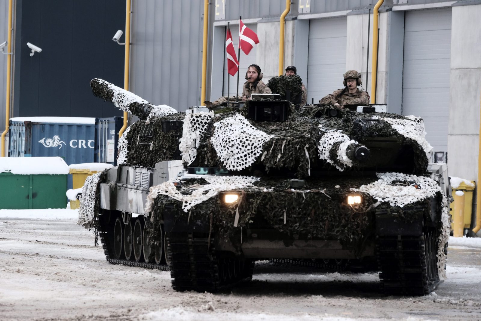 epa10416324 Danish Army serviceman with their main battle tanks Leopard 2 during the Ukraine Military Aid Meeting in Tapa military camp, Estonia, 19 January 2023. British Defense minister attended a meeting on Ukraine military aid at the Tapa Military Camp in Estonia, ahead of the Ramstein format meeting, an international meeting of donors providing military aid to Ukraine took place, where Estonia, the United Kingdom, and several other countries presented their newest aid packages. At an international meeting called together on the initiative of Estonia and the United Kingdom, participating states presented their newest military aid packages for Ukraine, which also include a significant amount of heavy weapons.  EPA/VALDA KALNINA