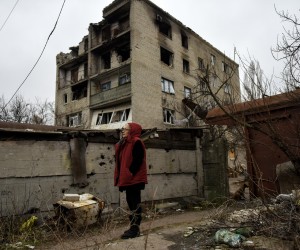 epa10423766 Lubov stands in the yard of her apartment block, in the town of Lyman, Donetsk region, Ukraine, 22 January 2023. Lubov has been living in the basement for 273 days, after her apartment on the top floor of the building was destroyed by shelling in April. Lyman was re-captured by Ukraine's armed forces in October. Before the beginning of active combat action population of Lyman was around 41,000. After being under Russian occupation, without electricity, water and gas supply, infrastructure is slowly renewing. Russian troops entered Ukraine terriroty on 24 February 2022, starting an armed conflict that has provoked destruction and a humanitarian crisis.  EPA/OLEG PETRASYUK