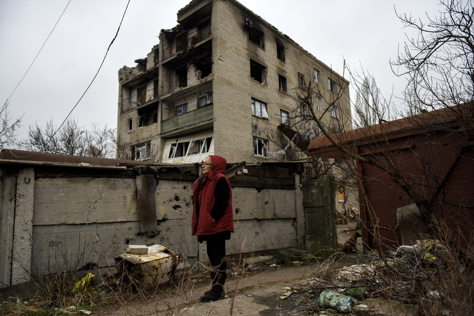 epa10423766 Lubov stands in the yard of her apartment block, in the town of Lyman, Donetsk region, Ukraine, 22 January 2023. Lubov has been living in the basement for 273 days, after her apartment on the top floor of the building was destroyed by shelling in April. Lyman was re-captured by Ukraine's armed forces in October. Before the beginning of active combat action population of Lyman was around 41,000. After being under Russian occupation, without electricity, water and gas supply, infrastructure is slowly renewing. Russian troops entered Ukraine terriroty on 24 February 2022, starting an armed conflict that has provoked destruction and a humanitarian crisis.  EPA/OLEG PETRASYUK