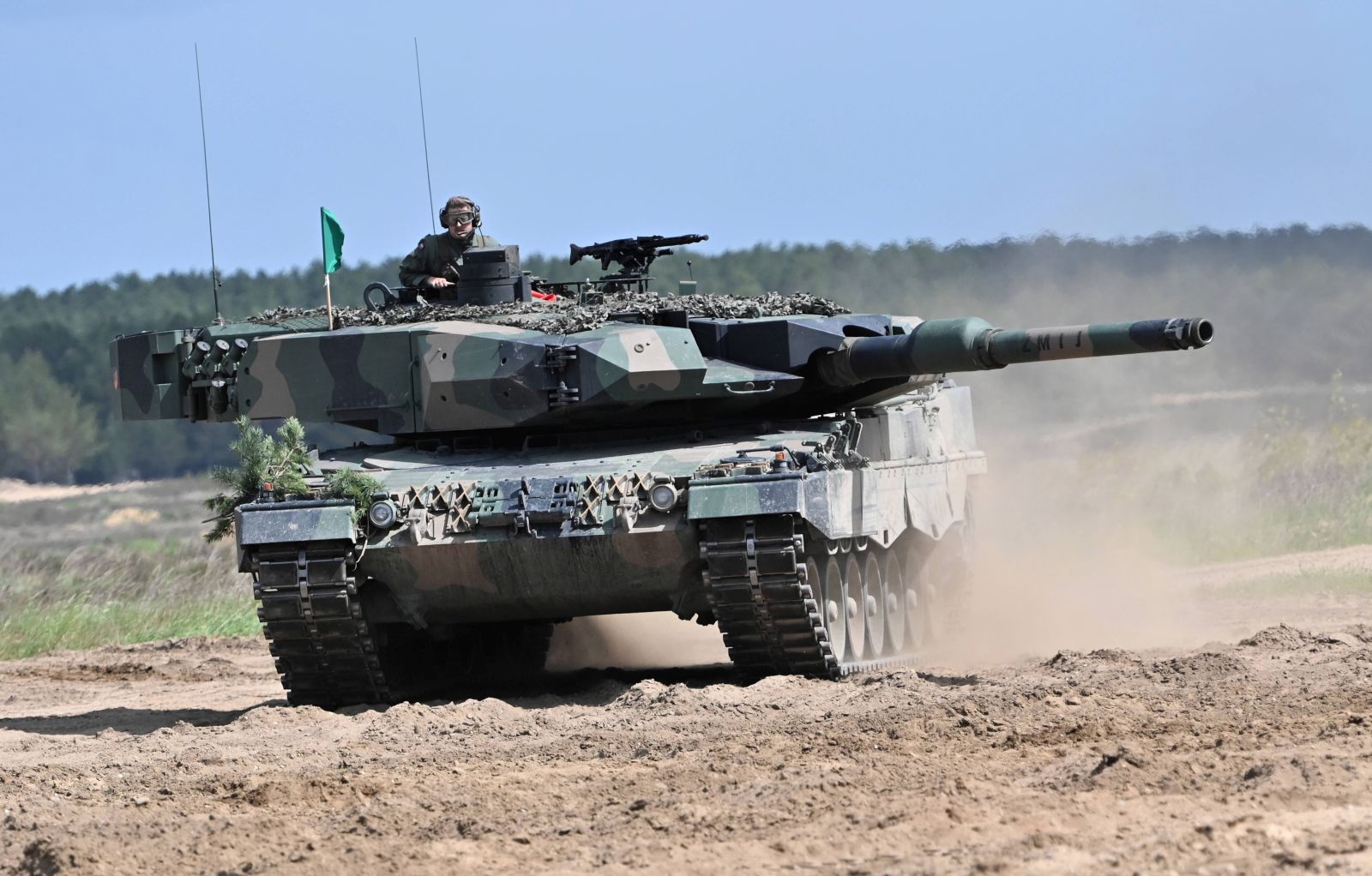 epa10424673 (FILE) - A 'Leopard 2PL' tank of the Polish army during the international exercise pk. DefenderEurope2022 at firing range Drawsko Pomorskie, northwest Poland, 27 May 2022 (reissued 23 January 2023). During a tour through the country, Polish Prime Minister Mateusz Morawiecki announced in Poznan on 23 January 2023, that Poland will 'formally ask Germany for permission to hand over some of its German-made Leopard 2 tanks to Ukraine', the Polish news agency PAP reported.  EPA/Marcin Bielecki POLAND OUT