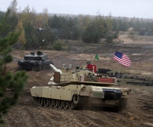 epa10429125 (FILE) - UK soldiers with their battle tank Challenger (L) and US soldiers with their battle tank Abrams (R) take part in gunnery shoot-off between the Enhanced Forward Presence nations at the military exercise Iron Tomahawk in Adazi Military Base, Latvia, 23 October 2018 (reissued 25 January 2023). The US are to send some 31 of their M1 Abrams tanks to the Ukraine, US President Biden announced on 25 January 2023. The annnouncement comes the same day Germany cleared the way for deliveries of German-made Leopard 2 tanks to the Ukraine. Russian troops entered Ukraine territory on 24 February 2022, starting an armed conflict that has provoked destruction and a humanitarian crisis.  EPA/VALDA KALNINA *** Local Caption *** 54722124