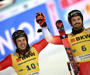epa10429827 Second placed Gino Caviezel (L) and first placed Loic Meillard (R) of Switzerland celebrate in finish area after the second run of the Men's Giant Slalom Night race of the FIS Alpine Skiing World Cup in Schladming, Austria, 25 January 2023.  EPA/CHRISTIAN BRUNA