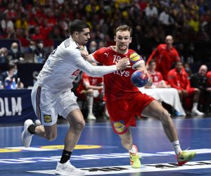 epa10439222 France's Mathieu Grebille and Denmark's Mathias Gidsel during the IHF Men's World Championship handball final match between Denmark and France, in Stockholm, Sweden, 29 January 2023.  EPA/Jessica Gow  SWEDEN OUT