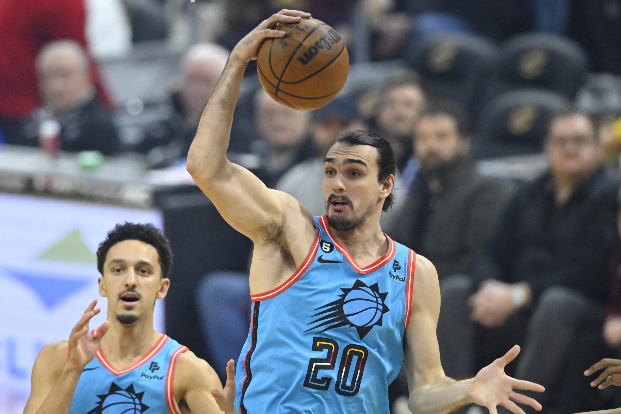 Jan 4, 2023; Cleveland, Ohio, USA; Phoenix Suns forward Dario Saric (20) rebounds in the first quarter against the Cleveland Cavaliers at Rocket Mortgage FieldHouse. Mandatory Credit: David Richard-USA TODAY Sports Photo: David Richard/REUTERS