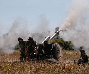 epa08625200 Militants of self-proclaimed Donetsk Peoples Republic (DPR) attend military exercises with a122-mm howitzer D-30 on a shooting range some 60 km south from pro-Russian militants controlled city of Donetsk, Ukraine, 25 August 2020. The meeting of political advisors to leaders of the Normandy Four states (Ukraine, Germany, France, and the Russian Federation), which was scheduled for 28 August 2020 has been canceled according to the RBC Ukraine news agency citing an an informed source. Earlier, participants in the Trilateral Contact Group (Ukraine, Russia, and the OSCE) on the peace settlement in Donbas on July 22 agreed on a full and comprehensive ceasefire along the contact line from 00:01 on 27 July 2020.  EPA/DAVE MUSTAINE