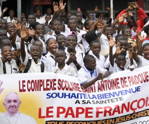 epa10441535 A handout picture provided by the Vatican Media shows faithfuls holding a banner welcoming Pope Francis (not pictured) as he arrives in Kinshasa, Democratic Republic of Congo (DRC), 31 January 2023. Pope Francis arrived in Kinshasa as he begins his Apostolic Journey to the Democratic Republic of Congo from 31 January to 03 February. He will then travel to South Sudan for an ecumenical peace pilgrimage from 03 to 05 February.  EPA/VATICAN MEDIA HANDOUT  HANDOUT EDITORIAL USE ONLY/NO SALES