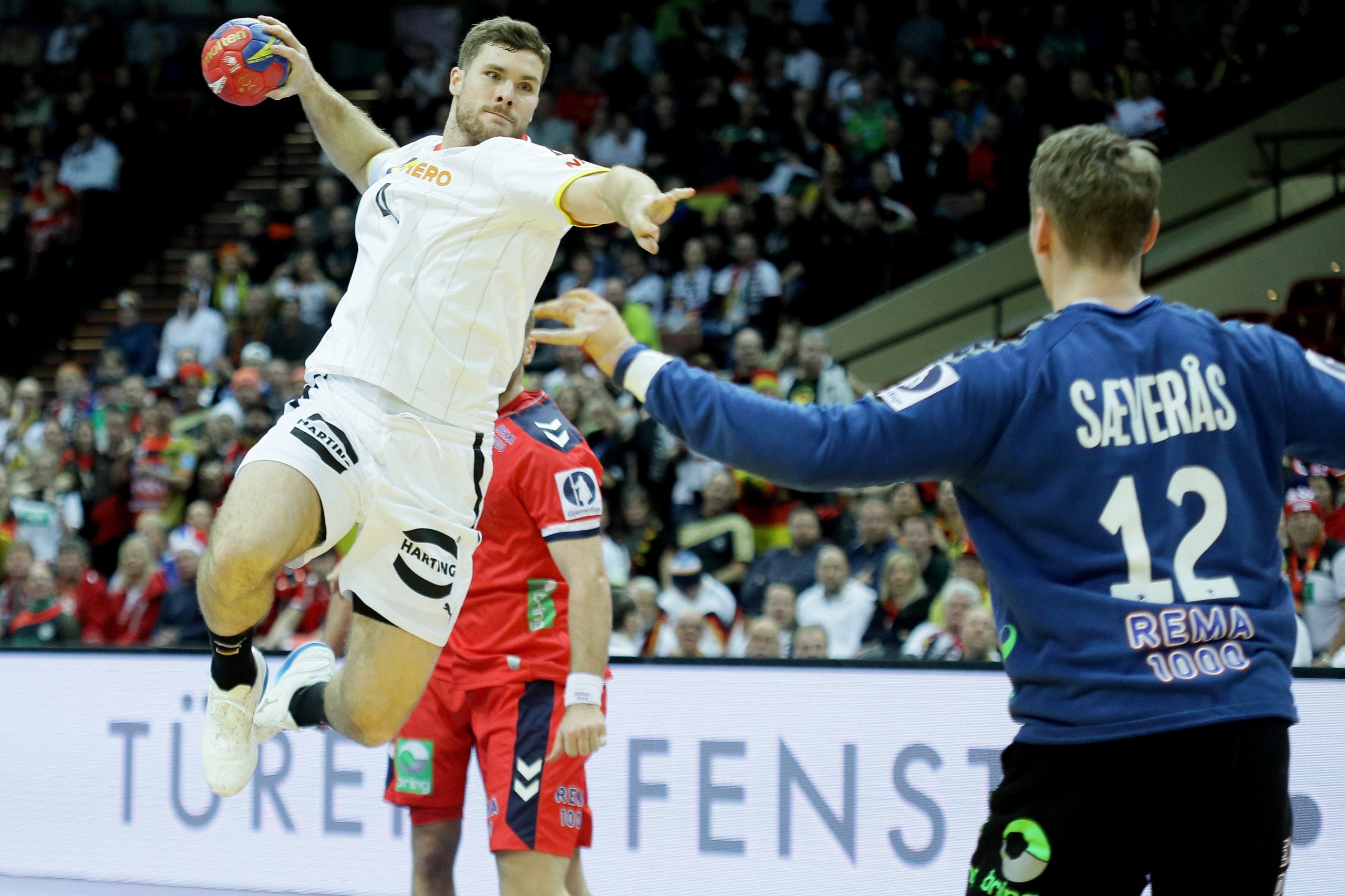 epa10425512 Johannes Golla (L) of Germany and Kristian Saeveras (R) of Norway in action during the 28th IHF Men’s World Handball Championship 2023 group III match between Germany and Norway in Katowice, Poland, 23 January 2023.  EPA/Zbigniew Meissner POLAND OUT