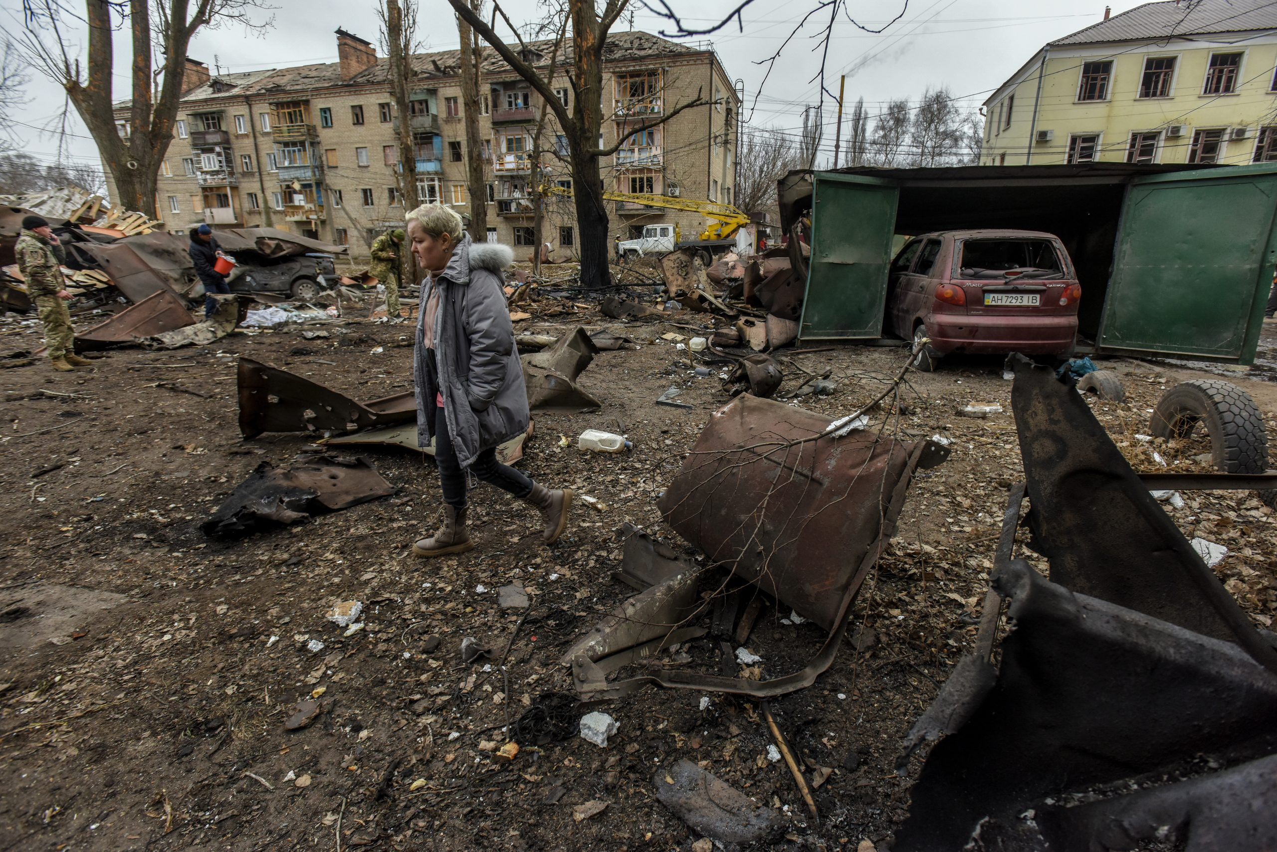 epa10436256 A local woman walks near the site of a Russian rocket strike in Konstyantynivka town, Donetsk region, eastern Ukraine, 28 January 2023. Three civilians were killed, and at least two injured as a result of Russia’s missile strike on the city of Kostyantynivka, according to Pavlo Kyrylenko, the head of the regional administration.  EPA/OLEG PETRASYUK
