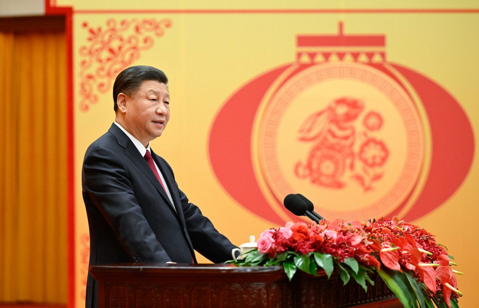 epa10419696 Chinese President Xi Jinping, general secretary of the Communist Party of China (CPC) Central Committee and chairman of the Central Military Commission, delivers a speech at a Spring Festival reception at the Great Hall of the People in Beijing, China, 20 January 2023 (Issued 21 January). The Communist Party of China (CPC) Central Committee and the State Council held the reception on 20 January in Beijing. his year's Spring Festival, or the Chinese Lunar New Year, falls on January 22.  EPA/XINHUA / Li Xueren CHINA OUT / MANDATORY CREDIT  EDITORIAL USE ONLY