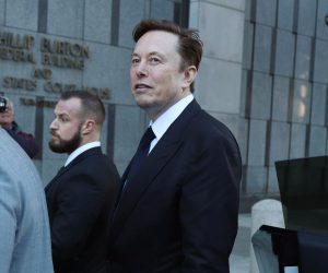 epa10427345 Tesla CEO Elon Musk (C) leaves the Phillip Burton Federal Building and U.S. Courthouse for the fourth day of the trial of Tesla shareholders lawsuit against Musk in San Francisco, California, USA, 24 January 2023. Tesla shareholders against CEO Elon Musk are taking him to court after he tweeted in 2018 that he could take Tesla private at 240 US dollars a share, a statement that caused volatility in the electric car company's stock price.  EPA/GEORGE NIKITIN
