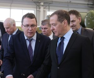 epa10444475 Deputy head of Russia's Security Council and chairman of the United Russia party Dmitry Medvedev (R) listens to General Director of Raduga Sergei Bogatikov (C) as he visits the Raduga State Machine Building Construction Bureau named after A. Bereznyak, in Dubna, Moscow region, Russia, 02 February 2023.  EPA/EKATERINA SHTUKINA / SPUTNIK POOL MANDATORY CREDIT