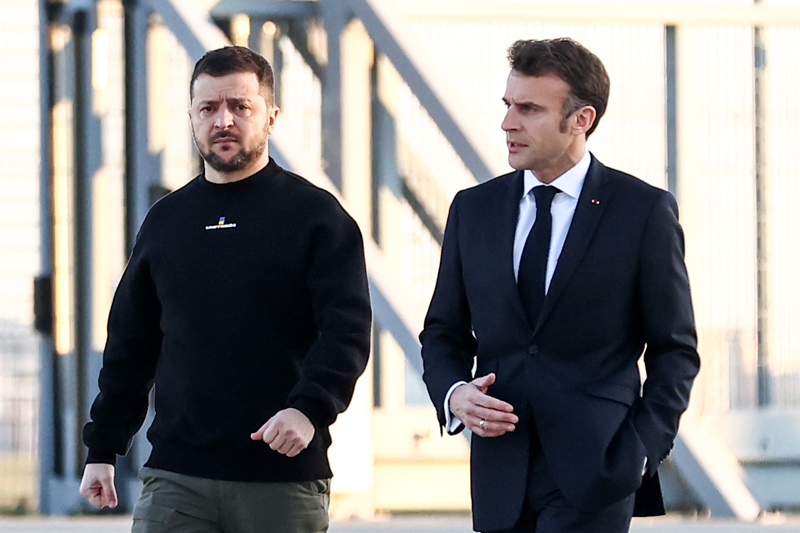epa10456065 French President Emmanuel Macron (R) walks next to Ukraine's President Volodymyr Zelensky (L) before heading to Brussels, in Military Airport Villacoublay, in Velizy-Villacoublay, Southwest of Paris, France, 09 February 2023.
French President Macron and Ukrainian president Zelensky and travelling together to Brussels to take a part in a summit of European Union leaders.  EPA/Mohammed Badra / POOL