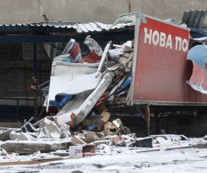 epa10462679 The site of the damaged 'Nova Poshta' postal storehouse following a missile strike, in Kharkiv, northeastern Ukraine, 12 February 2023, amid Russia's invasion. At least one man was injured after Russian missiles hit Kharkiv on 11 February late evening, the head of the Kharkiv regional military administration, said. Kharkiv and surrounding areas have been the target of heavy shelling since February 2022, when Russian troops entered Ukraine starting a conflict that has provoked destruction and a humanitarian crisis.  EPA/SERGEY KOZLOV