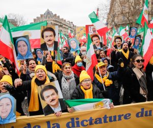 epa10463087 Supporters hold portrait of Masud Rajavi (R), one of the leaders of the  People's Mojahedin Organization of Iran, and Maryam Rajavi (L), President of the Iranian National Council of Resistance, during a demonstration on the 44th anniversary of the Iranian revolution against Shahh Reza Pahlavi, in Paris, France, 12 February 2023. The protesters rejected the Shah's dictatorshipin the then Imperial State of Iran from 16 September 1941 until he was overthrown in the Iranian Revolution on 11 February 1979, and the following mullahs' theocracy and called for a democratic and secular government in Iran.  EPA/TERESA SUAREZ