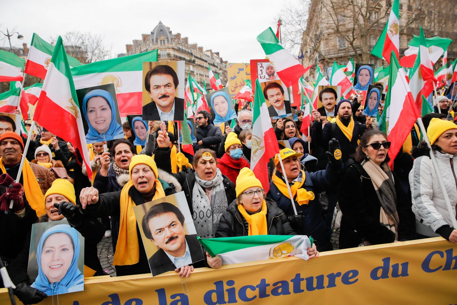 epa10463087 Supporters hold portrait of Masud Rajavi (R), one of the leaders of the  People's Mojahedin Organization of Iran, and Maryam Rajavi (L), President of the Iranian National Council of Resistance, during a demonstration on the 44th anniversary of the Iranian revolution against Shahh Reza Pahlavi, in Paris, France, 12 February 2023. The protesters rejected the Shah's dictatorshipin the then Imperial State of Iran from 16 September 1941 until he was overthrown in the Iranian Revolution on 11 February 1979, and the following mullahs' theocracy and called for a democratic and secular government in Iran.  EPA/TERESA SUAREZ