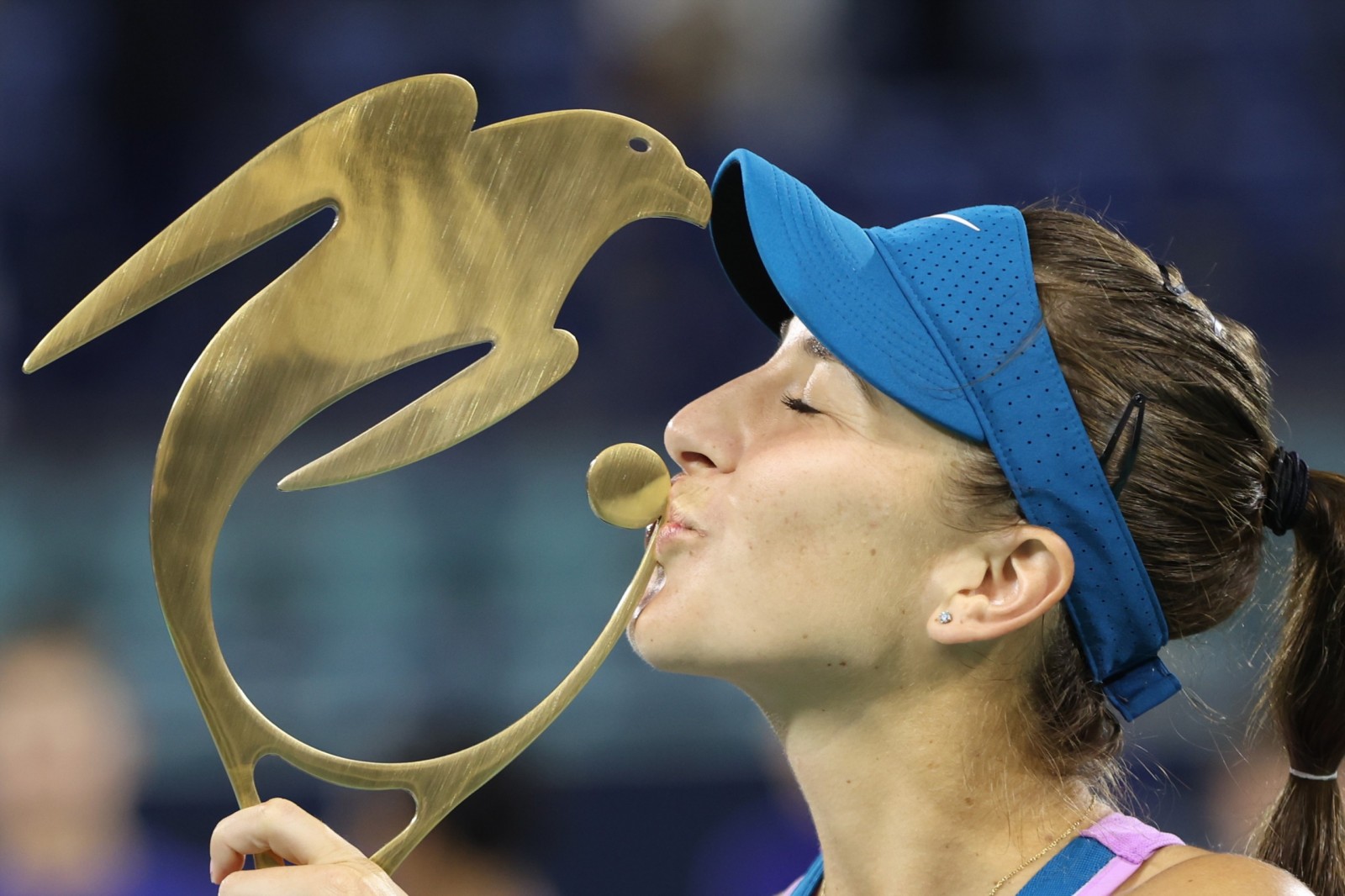 epa10463400 Belinda Bencic of Switzerland celebrates with the trophy after winning her final match against Liudmila Samsonova of Russia at WTA Abu Dhabi Open in Abu Dhabi, United Arab Emirates, 12 February 2023.  EPA/ALI HAIDER