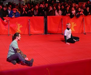 epa10471305 Activists are glued on the red carpet at the Opening Ceremony of the 73rd Berlin International Film Festival 'Berlinale' in Berlin, Germany, 16 February 2023. The in-person event runs from 16 to 26 February 2023.  EPA/FILIP SINGER