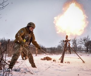 epa10473561 Ukrainian serviceman of the " 24 separate mechanized brigade named after King Danylo" fires a mortar towards Russian positions, at an undisclosed location, Donetsk region, eastern Ukraine, 17 February 2023.  Russian troops entered Ukraine on 24 February 2022 starting a conflict that has provoked destruction and a humanitarian crisis.  EPA/OLEG PETRASYUK