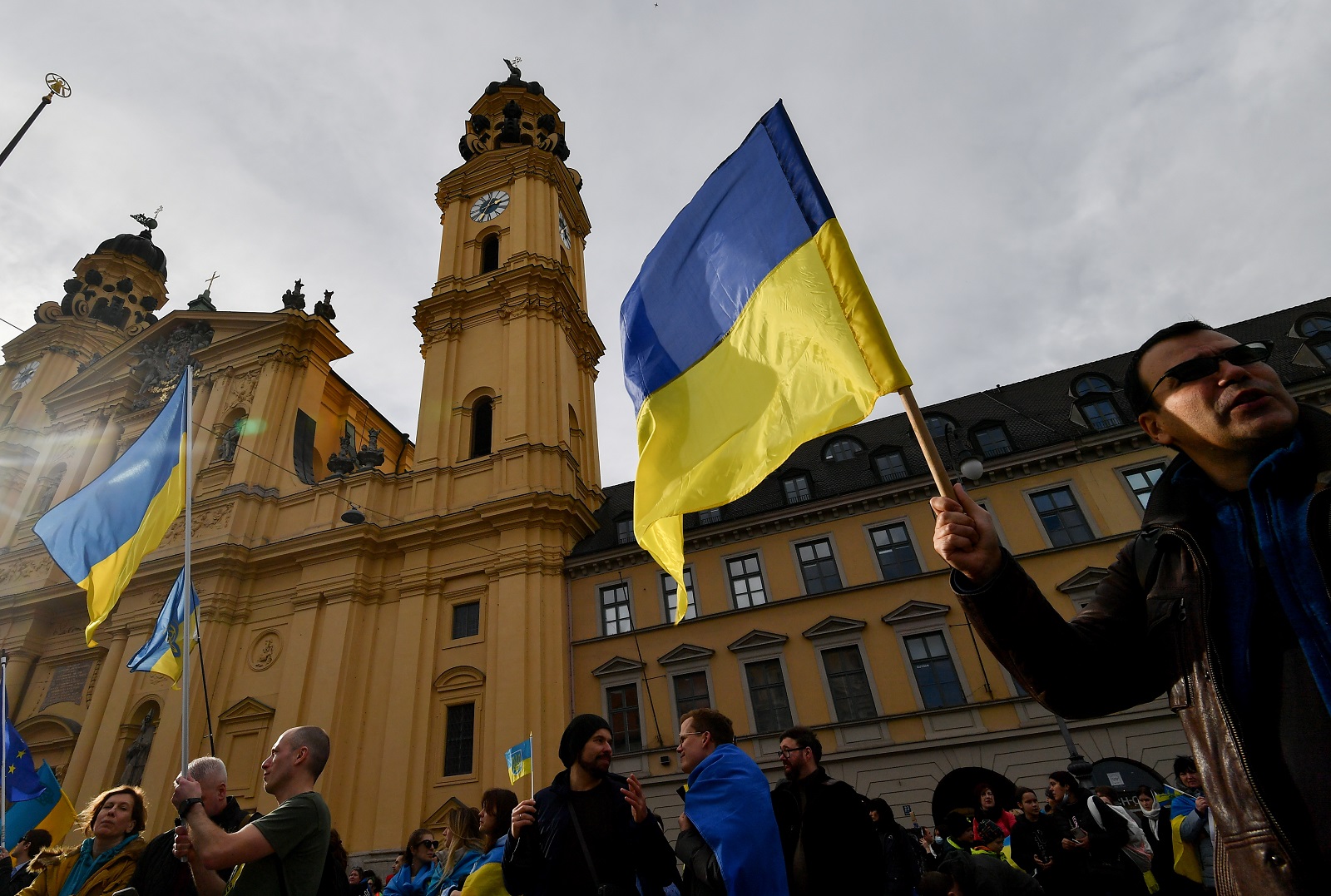 epa10475078 A woman holds Ukraine's flag during a rally supporting Ukraine during the 59th Munich Security Conference (MSC) in Munich, Germany, 18 February 2023. More than 500 high-level international decision-makers meet at the 59th Munich Security Conference in Munich during their annual meeting from 17 to 19 February 2023 to discuss global security issues.  EPA/ANNA SZILAGYI