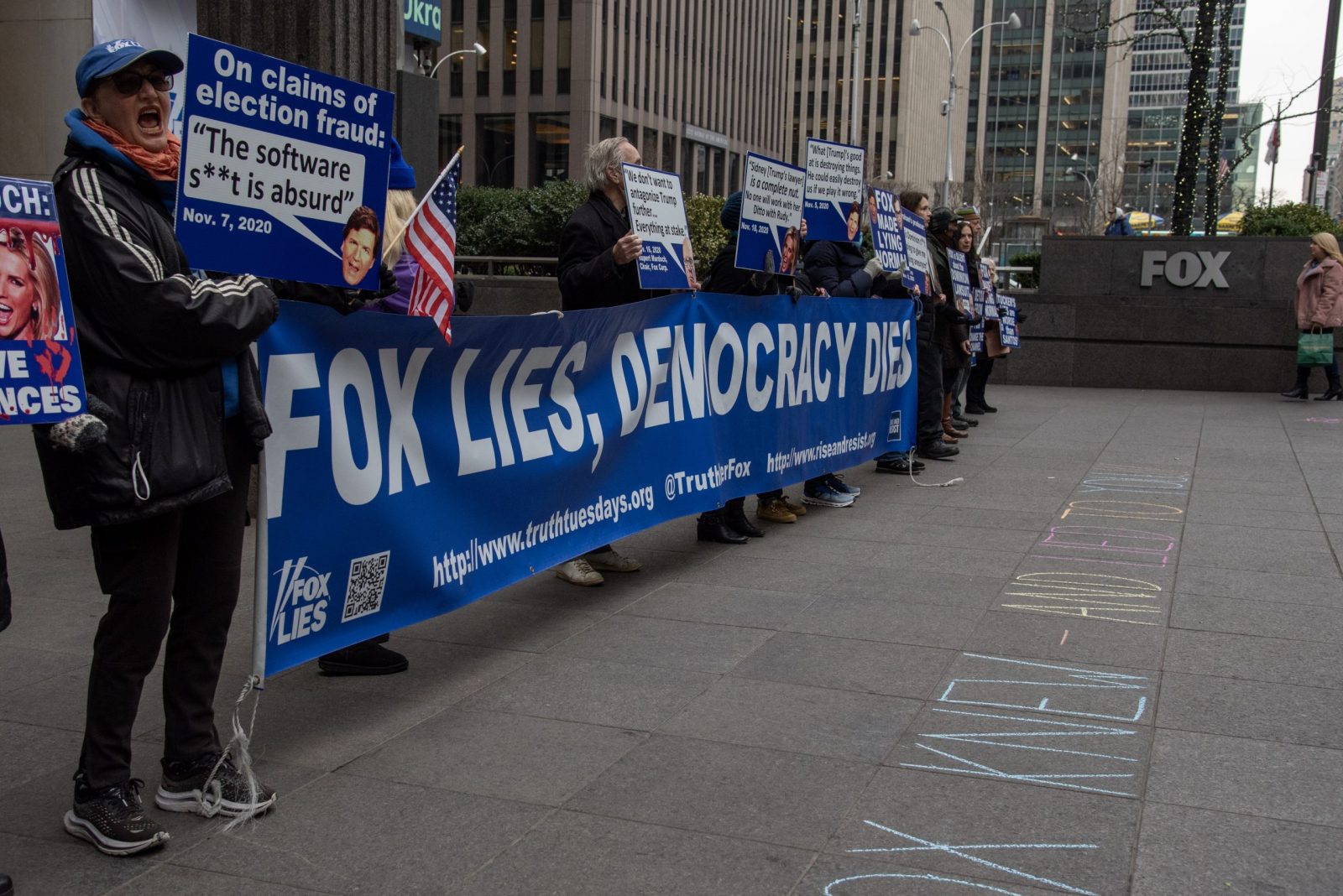 epa10482269 People protest outside of the Fox News headquarters in response to the Dominion lawsuit against Fox Corporation in New York, New York, USA, 21 February 2023. Dominion’s defamation suit is in response to the 2020 election, alleging far-right conspiracy theories tying the company’s machines to election fraud have negatively impacted their business.  EPA/SARAH YENESEL