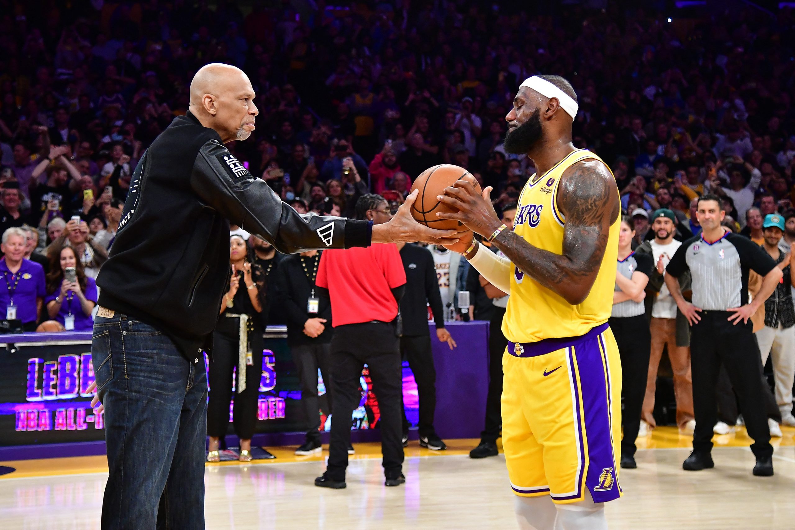 Feb 7, 2023; Los Angeles, California, USA; Former Los Angeles Lakers player Kareem Abdul-Jabbar hands the game ball to forward LeBron James (6) after James becomes the NBA all time scoring leader against the Oklahoma City Thunder during the second half at Crypto.com Arena. Mandatory Credit: Gary A. Vasquez-USA TODAY Sports Photo: Gary A. Vasquez/REUTERS