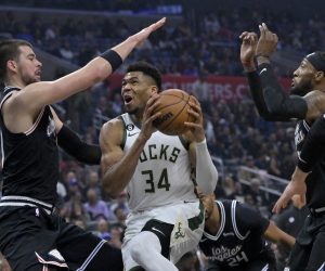 Feb 10, 2023; Los Angeles, California, USA;  Milwaukee Bucks forward Giannis Antetokounmpo (34) drives past Los Angeles Clippers center Ivica Zubac (40) and forward Robert Covington (23) for a basket in the first half at Crypto.com Arena. Mandatory Credit: Jayne Kamin-Oncea-USA TODAY Sports Photo: Jayne Kamin-Oncea/REUTERS