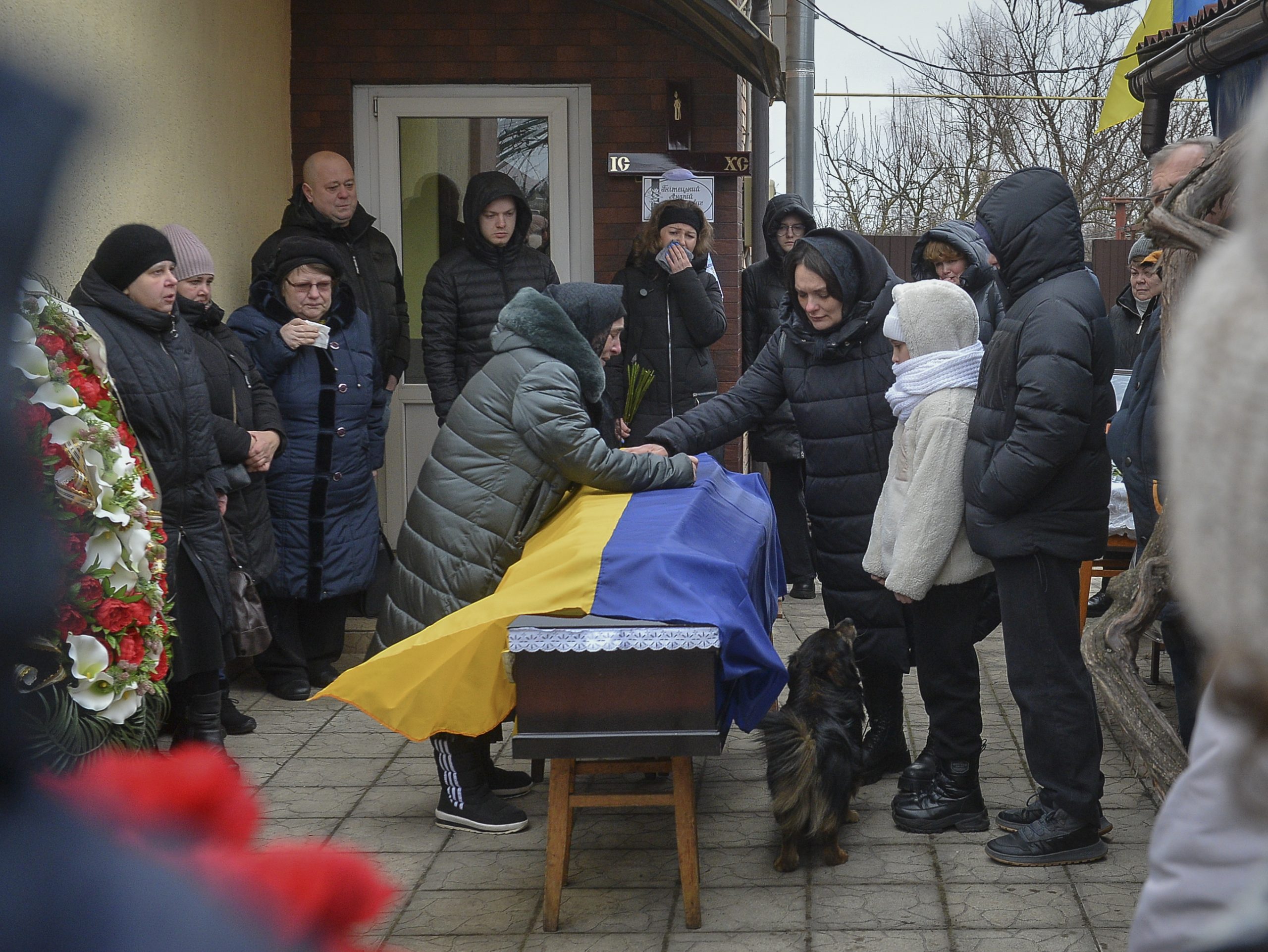 epa10465058 Relatives, friends, and comrades attend the funeral ceremony for Ukrainian serviceman Andriy Gnitetskiy, in Hostomel, near Kyiv (Kiev), Ukraine, 13 February 2023. Andriy Gnitetskiy was killed in fighting near the frontline city of Soledar, eastern Ukraine. Russian troops on 24 February 2022 entered Ukrainian territory, starting an armed conflict that has provoked destruction and a humanitarian crisis.  EPA/ANDRII NESTERENKO