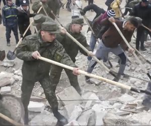 epa10452107 A still image taken from a handout video provided by the Russian Defence Ministry Press-Service on 07 February 2023 shows Russian servicemen searching for victims at the site of a collapsed building after a major earthquake in Latakia, Syria. More than 4,000 people were killed and thousands more injured after a major 7.8 magnitude earthquake struck southern Turkey and northern Syria on 06 February. Authorities fear the death toll will keep climbing as rescuers look for survivors across the region.  EPA/RUSSIAN DEFENCE MINISTRY PRESS SERVICE HANDOUT -- BEST QUALITY AVAILABLE -- MANDATORY CREDIT -- HANDOUT EDITORIAL USE ONLY/NO SALES