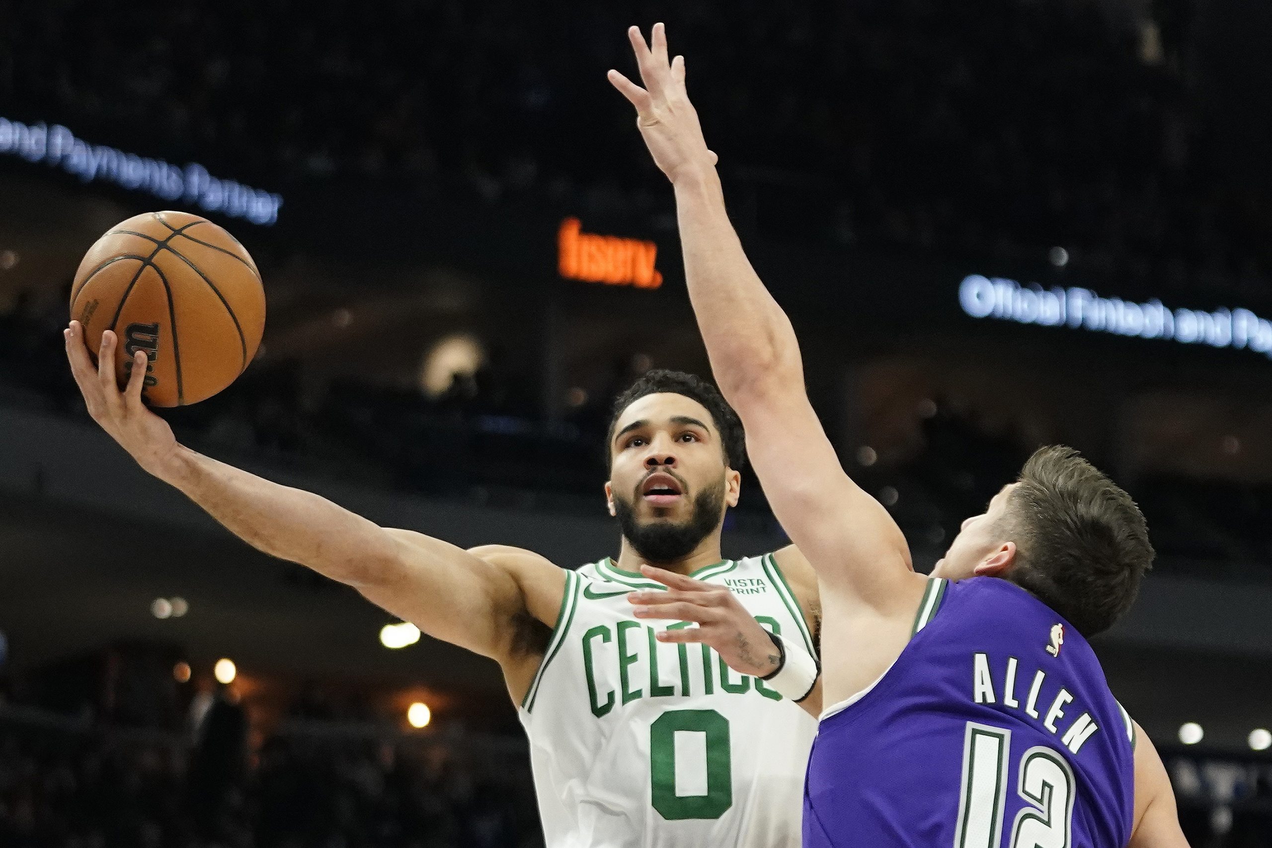 Boston Celtics' Jayson Tatum (0) shoots against Milwaukee Bucks' Grayson Allen during the first half of an NBA basketball game Thursday, March 30, 2023, in Milwaukee. (AP Photo/Aaron Gash)