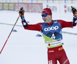 epa10488472 Simen Hegstad Krueger of Norway celebrates after winning the Men's Skiathlon 15.0km Classic + 15.0km Free competition at the FIS Nordic Skiing World Championships in Planica, Slovenia, 24 February 2023.  EPA/ANTONIO BAT