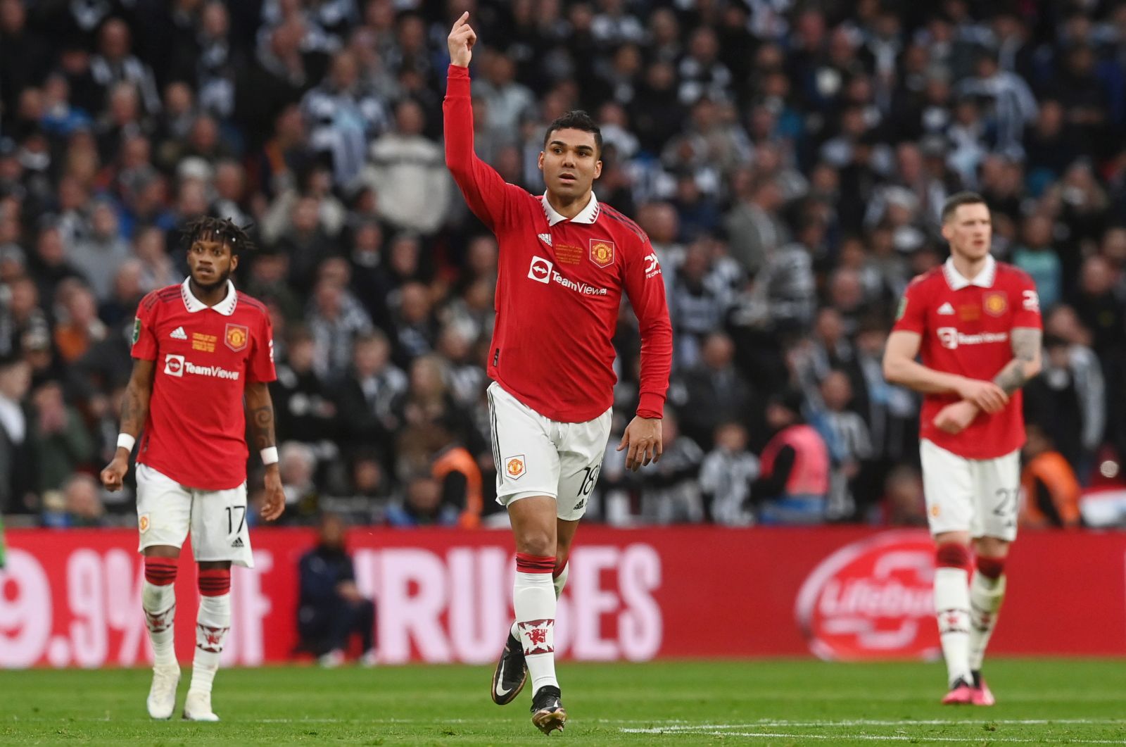 epa10492694 Manchester United's Casemiro (C) celebrates after scoring his teams first goal during the Carabao Cup final soccer match between Manchester United and Newcastle United, in London, Britain, 26 February 2023.  EPA/NEIL HALL