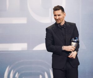 epa10494449 Argentinian soccer player Lionel Messi of Paris Saint-Germain FC with his the Best FIFA Men's Player Award on stage during the The Best FIFA Football Awards 2022 ceremony in Paris, France, 27 February 2023.  EPA/YOAN VALAT