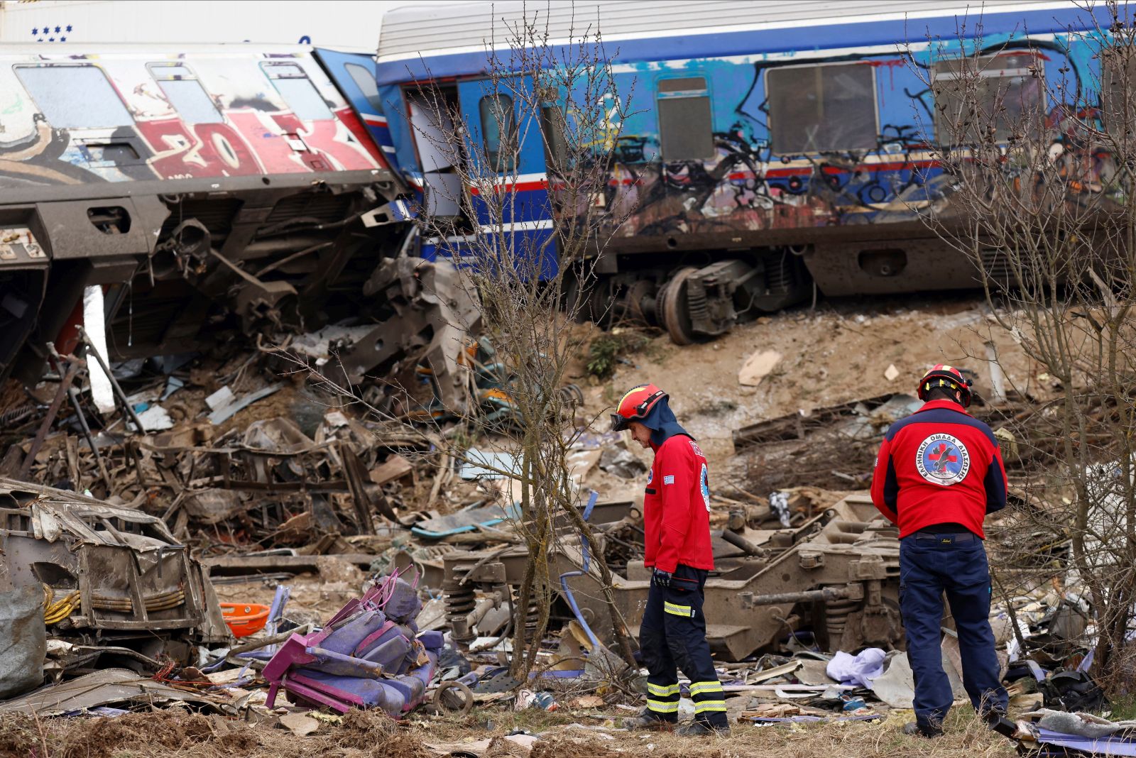 epa10497109 Rescuers at the scene of a train collision, near Larissa city, Greece, 01 March 2023. Fire fighter and ambulance service crews remain at the scene, while special crews were using cutting tools and blow torches to cut and prise apart the remains of the carriages to look for people or bodies possibly trapped inside. According to the latest update by the fire brigade spokesperson Vasilis Vathrakogiannis, the death toll was 36 so far and 66 people had been taken to hospital, six of which were admitted to ICUs.  EPA/ACHILLEAS CHIRAS