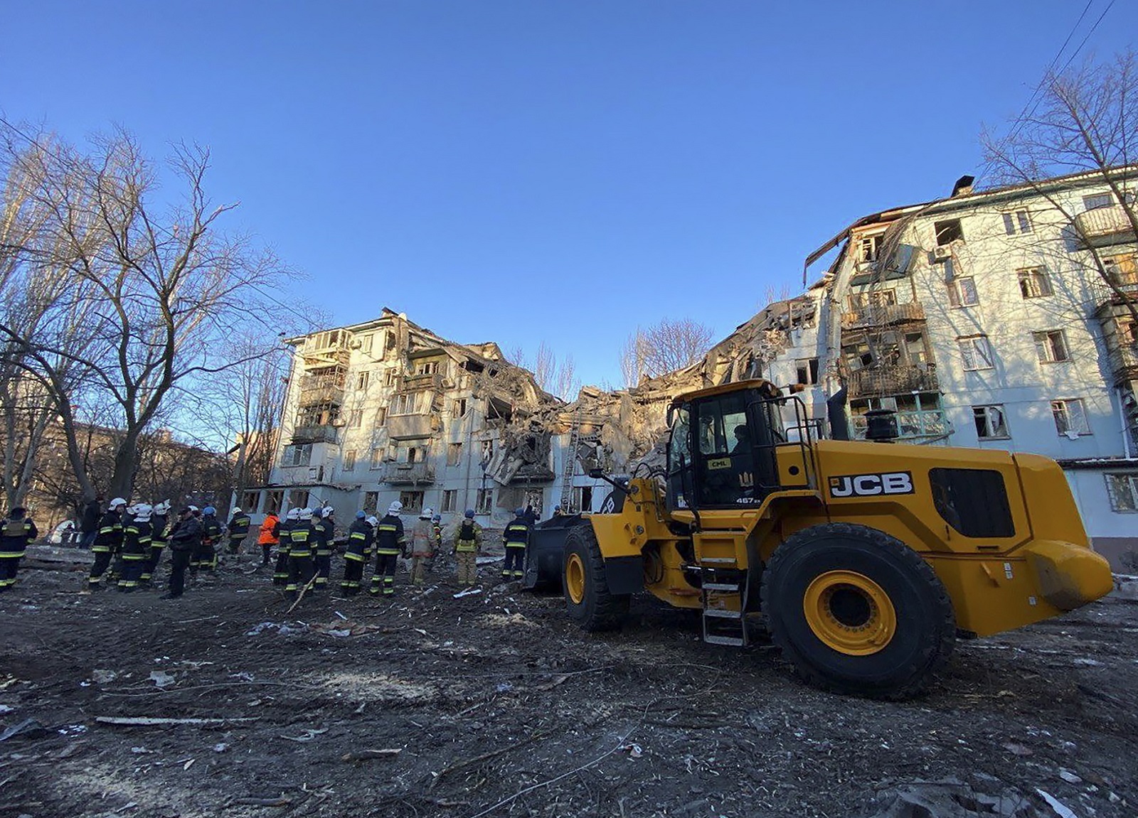 epa10498406 A handout photo made available by the State Emergency Service (SES) shows emergency services at the site of a damaged residential building in Zaporizhzhia, Ukraine, 02 March 2023. At least two people died and 11 others were injured after a rocket hit a five-story building in Zaporizhzhia, the State Emergency Service (SES) of Ukraine report. Russian troops entered Ukraine on 24 February 2022 starting a conflict that has provoked destruction and a humanitarian crisis.  EPA/STATE EMERGENCY SERVICE HANDOUT HANDOUT HANDOUT EDITORIAL USE ONLY/NO SALES