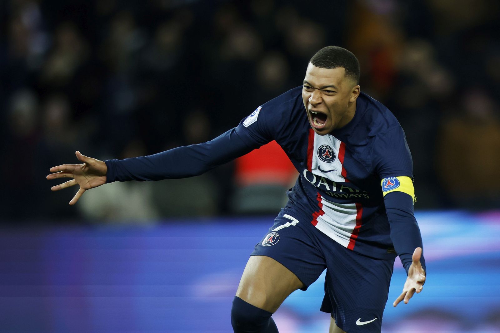 epa10503677 Paris Saint Germain's Kylian Mbappe celebrates scoring the 4-2 goal during the French Ligue 1 soccer match between PSG and FC Nantes, in Paris, France, 04 March 2023. Mbappe became the all time goal scorer for PSG with 201 goals.  EPA/YOAN VALAT