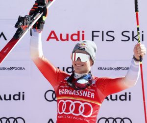 epa10515010 Winner Marco Odermatt of Switzerland celebrates on the podium for the Men's Giant Slalom race at the FIS Alpine Skiing World Cup in Kranjska Gora, Slovenia, 11 March 2023.  EPA/ANTONIO BAT