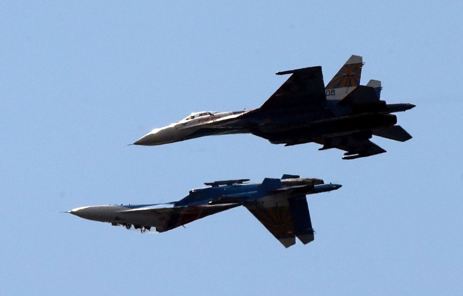 epa10522667 (FILE) - Two Russian SU-27 aircraft perform during the International Maritime Defence Show (IMDS) in St. Petersburg, Russia, 07 July 2013 (reissued 14 March 2023). The United States European Command (EUCOM) said in a statement that two Russian Su-27 aircraft 'conducted an unsafe and unprofessional intercept' with a US unmanned MQ-9 aircraft that was operating within international airspace over the Black Sea on 14 March 2023. The incident occurred at about 7:03 AM (CET) when one of the Russian aircraft struck the propeller of the MQ-9 causing US forces to bring the unmanned aircraft down in international waters, the statement added.  EPA/ANATOLY MALTSEV *** Local Caption *** 50908986