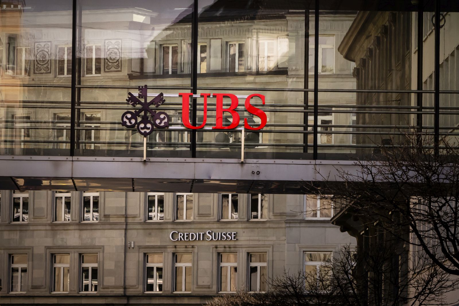 epa10530045 Logos of the Swiss banks 'Credit Suisse' and 'UBS' are seen on different buildings in Zurich, Switzerland, 18 March 2023.  EPA/MICHAEL BUHOLZER