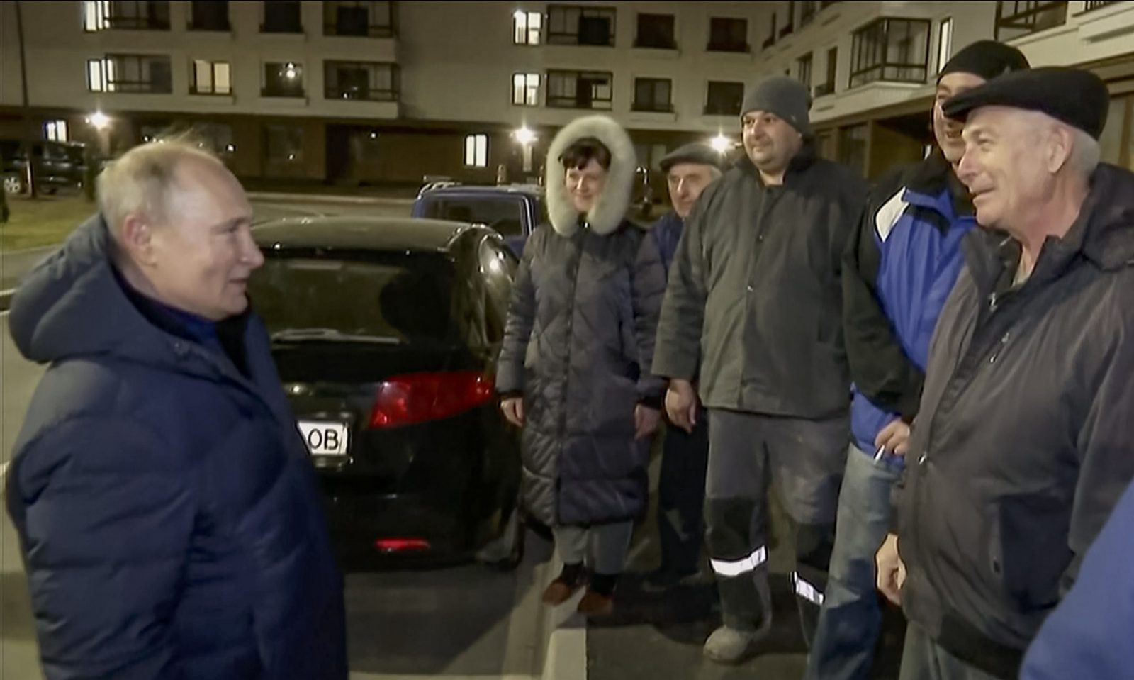 epa10532079 A still image taken from a handout video provided by the Russian President's press service on 19 March 2023 shows Russian President Vladimir Putin (L) speaks with locals during his visit to Mariupol, eastern Ukraine, late 18 March 2023. Putin visited the Russian-occupied city after he visited Crimea on the ninth anniversary of Russia's annexation of the Black Sea peninsula. According to the Kremlin, Putin had conversations with local residents, visited an apartment of one of the locals, assessed new roads, and followed the construction of new facilities in the city. On 24 February 2022 Russian troops entered the Ukrainian territory in what the Russian president declared to be a 'Special Military Operation', starting an armed conflict that has provoked destruction and a humanitarian crisis.  EPA/RUSSIAN PRESIDENT PRESS SERVICE/HANDOUT HANDOUT BEST QUALITY AVAILABLE HANDOUT EDITORIAL USE ONLY/NO SALES