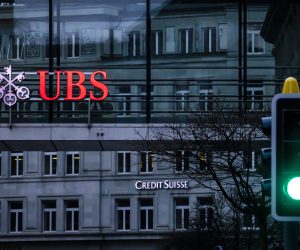 epa10532710 The logos of the Swiss banks Credit Suisse and UBS are displayed on different buildings behind traffic lights in Zurich, Switzerland, 19 March 2023. The bank UBS takes over Credit Suisse for 2 billion US dollars. Shares of Credit Suisse lost more than one-quarter of their value on 15 March 2023, hitting a record low after its biggest shareholder, the Saudi National Bank, told outlets that it would not inject more money into the ailing Swiss bank.  EPA/MICHAEL BUHOLZER