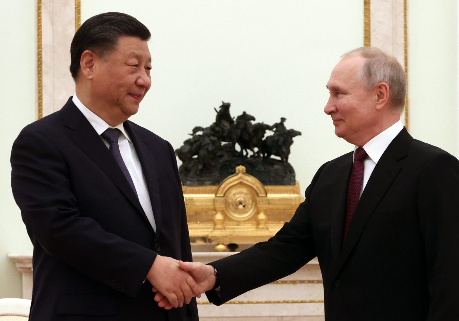 epa10533764 Russian President Vladimir Putin (R) shakes hands with Chinese President Xi Jinping (L) during their meeting in Moscow Kremlin in Moscow, Russia, 20 March 2023. Chinese President Xi Jinping arrived in Moscow on a three-day visit, which will last from March 20 to 22, according to Russian and Chinese state agencies. Xi Jinping visits Russia on improving joint partnership and developing key areas of Russian-Chinese economic cooperation.  EPA/SERGEI KARPUHIN / SPUTNIK / KREMLIN POOL MANDATORY CREDIT
