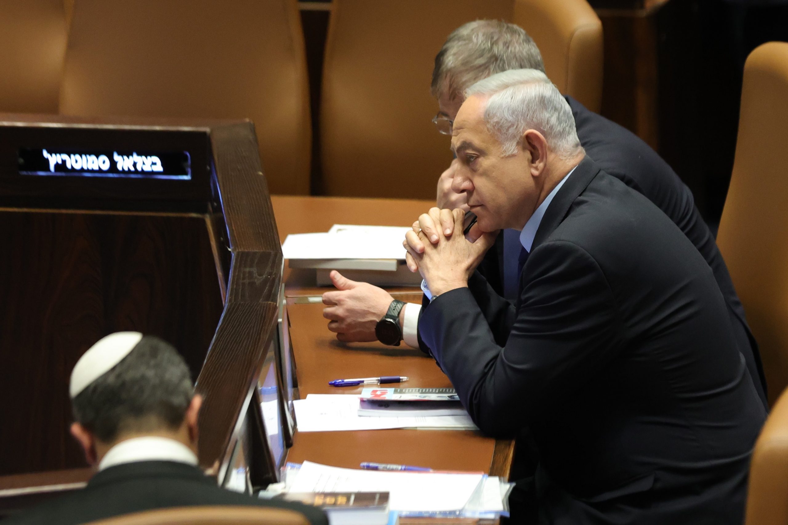 epa10536862 Israeli Prime Minister Benjamin Netanyahu attends a voting session on judicial reform bill at the Knesset Plenum, in Jerusalem, Israel, 22 March 2023. Nationwide protests against the government's judicial reform plans are being held for 12 weeks in a row. Israel's parliament passed a draft law limiting the power of the Israeli Supreme Court in a first reading on 14 March.  EPA/ABIR SULTAN
