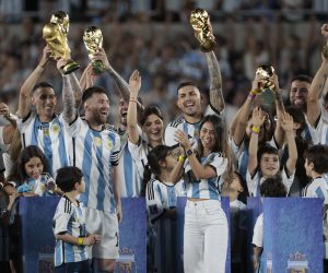 epa10539740 Lionel Messi (L) of Argentina lifts the trophy of FIFA World Cup accompanied by his wife Antonela Roccuzzo (R) and teammates after an international friendly soccer match between the national teams of Argentina and Panama at Monumental stadium in Buenos Aires, Argentina, 23 March 2023.  EPA/JUAN IGNACIO RONCORONI