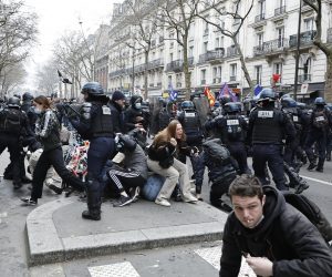 epa10547303 Riot police in clash with protesters during a rally against the government's pension reform in Paris, France, 28 March 2023. France faces an ongoing national strike against the government's pensions reform after tthe French prime minister announced on 16 March 2023 the use of Article 49 paragraph 3 (49.3) of the French Constitution to have the text on the controversial pension reform law - raising retirement age from 62 to 64 - be definitively adopted without a vote.  EPA/CHRISTOPHE PETIT TESSON