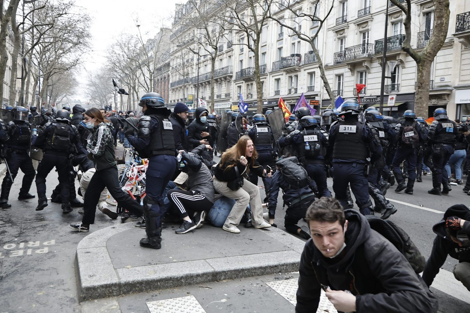 epa10547303 Riot police in clash with protesters during a rally against the government's pension reform in Paris, France, 28 March 2023. France faces an ongoing national strike against the government's pensions reform after tthe French prime minister announced on 16 March 2023 the use of Article 49 paragraph 3 (49.3) of the French Constitution to have the text on the controversial pension reform law - raising retirement age from 62 to 64 - be definitively adopted without a vote.  EPA/CHRISTOPHE PETIT TESSON